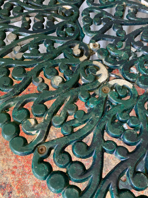 A green garden table and chairs set
