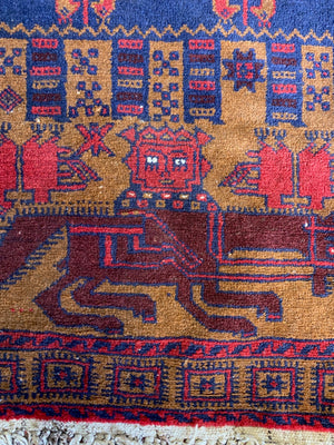 A Persian or Kurdish red ground pictorial rug - 165cm x 92cm