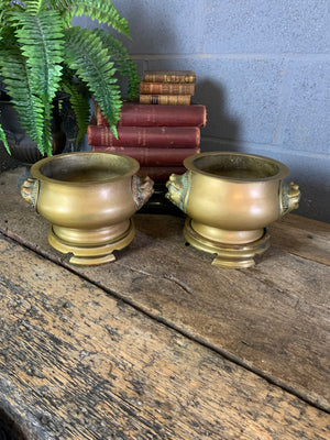 A pair of Asain bronze jardinieres on stands