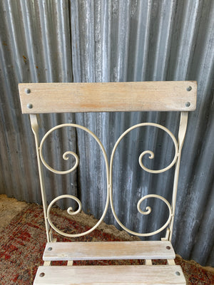 A white garden table and chairs set