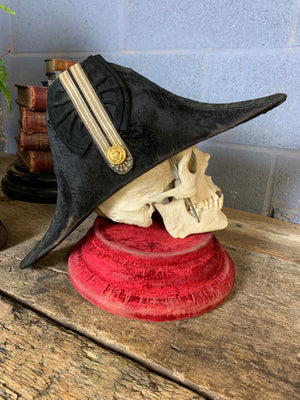 A Royal Navy bicorn hat in monogrammed tin