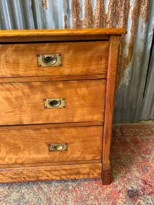 A satinwood chest of drawers