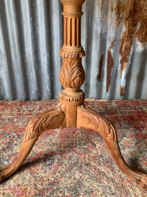 A Georgian style tilt top table with ball and claw feet