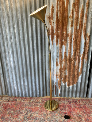 A swan neck brass floor lamp