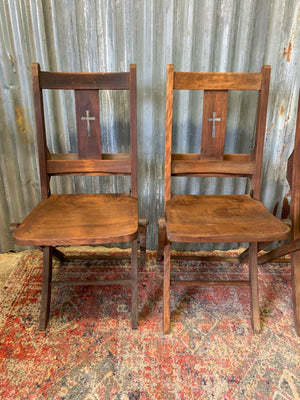 An Edwardian oak folding chapel chair by Mealing Bros