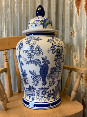 A pair of large blue and white ginger jars with parrot motifs