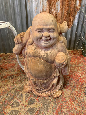 A large terracotta buddha statue