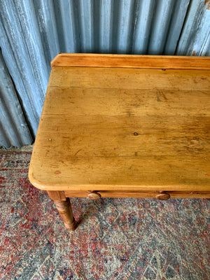 A pine two-drawer desk