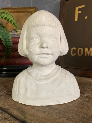 A plaster bust of a young girl by Hermann Würth- signed and dated