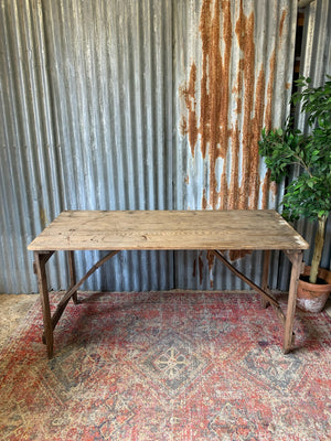 A 19th Century wooden folding trestle table