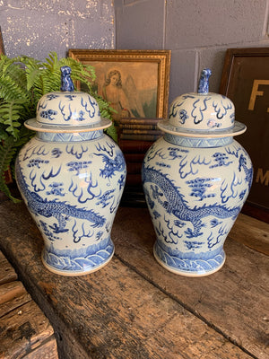 A pair of large blue and white ginger jars