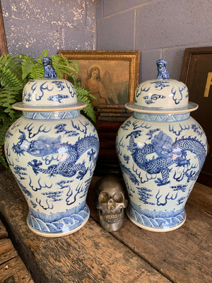 A pair of large blue and white ginger jars