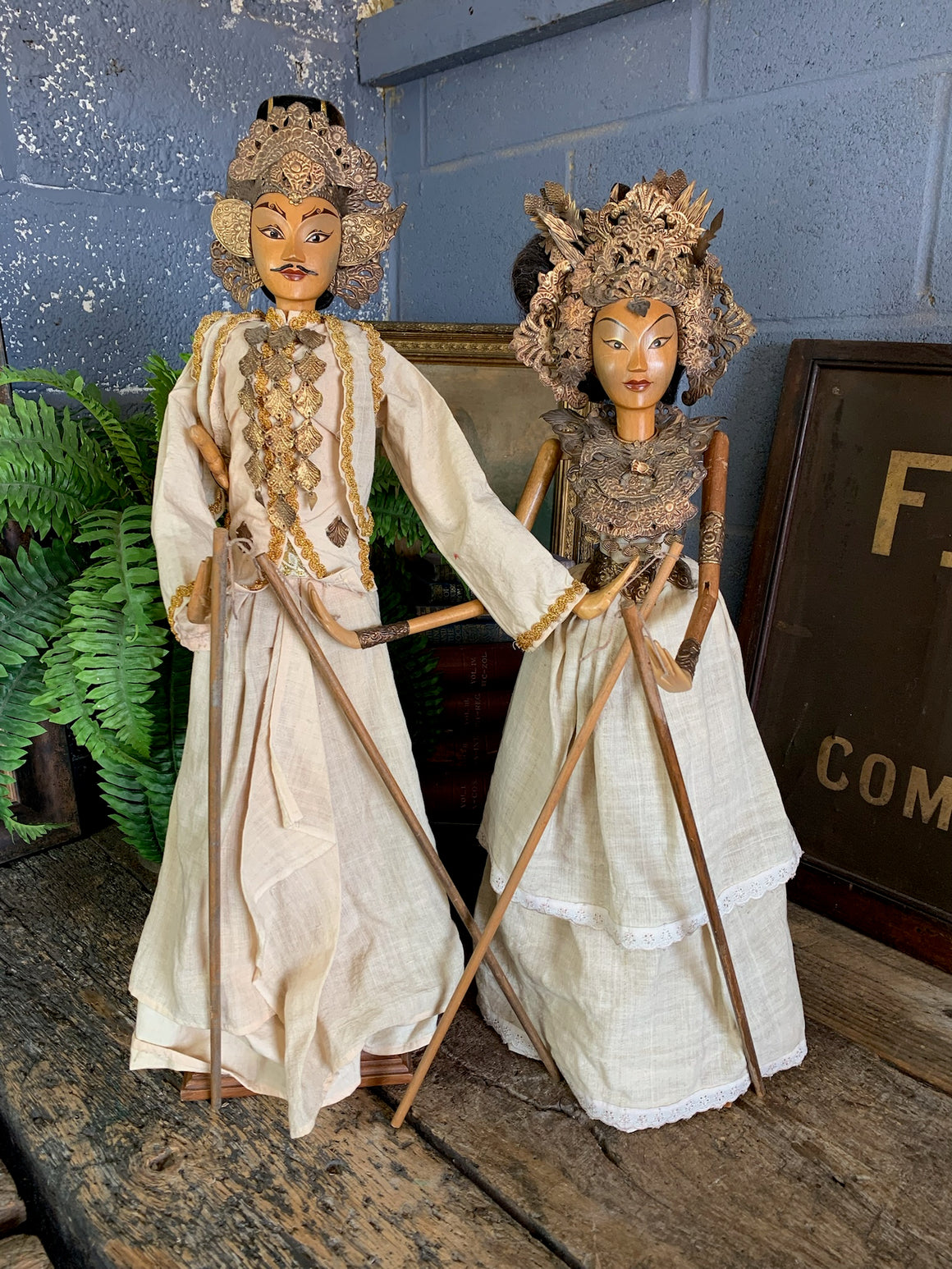 A pair of wooden Balinese marionettes