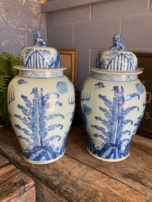 A pair of very large blue and white ginger jars