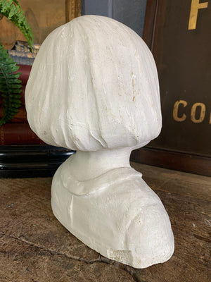 A plaster bust of a young girl by Hermann Würth- signed and dated