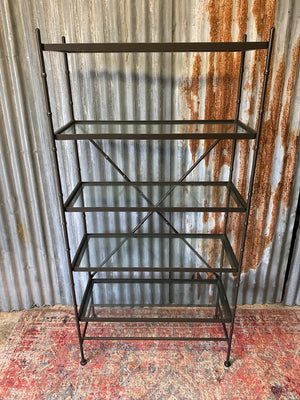 A faux bamboo metal and glass etagere