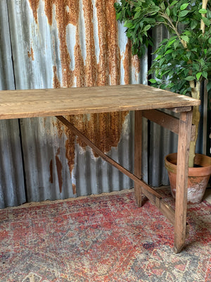 A 19th Century wooden folding trestle table