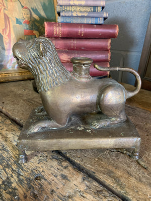 A bronze aquamanile in the form of a lion