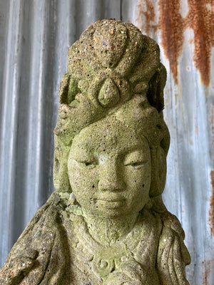 A cast stone garden statue of Guanyin