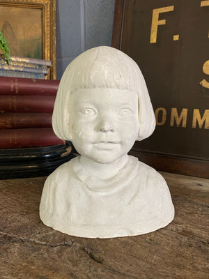 A plaster bust of a young girl by Hermann Würth- signed and dated