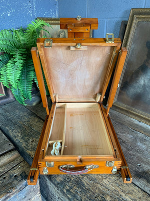 A floor-standing wooden field easel