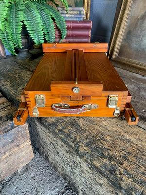 A floor-standing wooden field easel