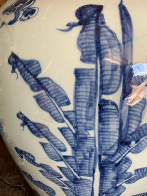 A pair of very large blue and white ginger jars