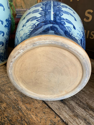 A pair of very large blue and white ginger jars