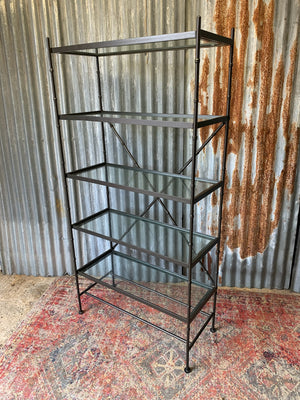 A faux bamboo metal and glass etagere