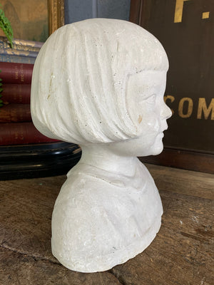 A plaster bust of a young girl by Hermann Würth- signed and dated