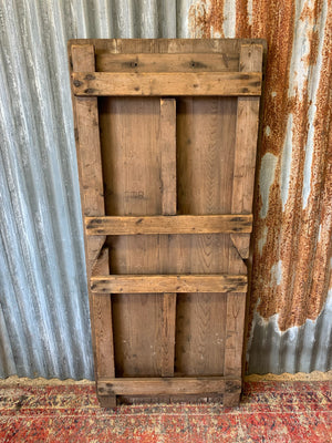 A 19th Century wooden folding trestle table