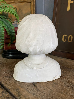 A plaster bust of a young girl by Hermann Würth- signed and dated