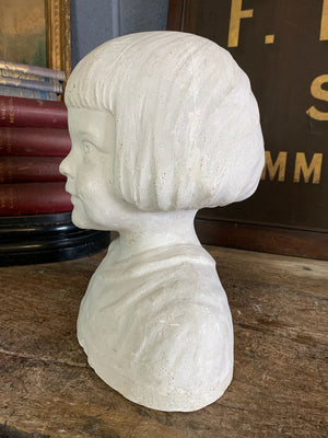 A plaster bust of a young girl by Hermann Würth- signed and dated