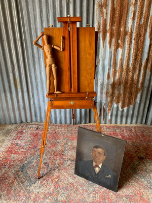 A floor-standing wooden field easel