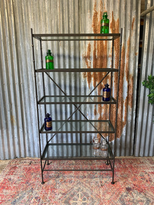 A faux bamboo metal and glass etagere