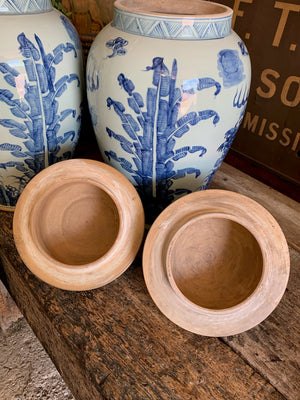 A pair of very large blue and white ginger jars