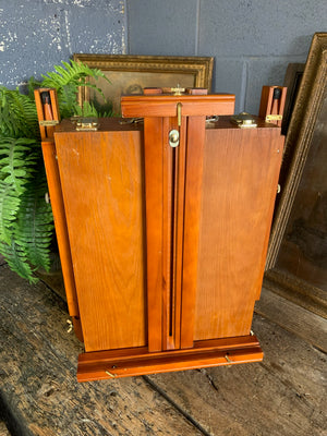 A floor-standing wooden field easel