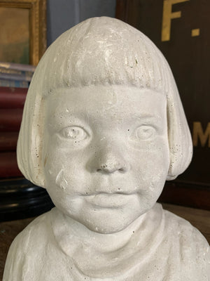 A plaster bust of a young girl by Hermann Würth- signed and dated