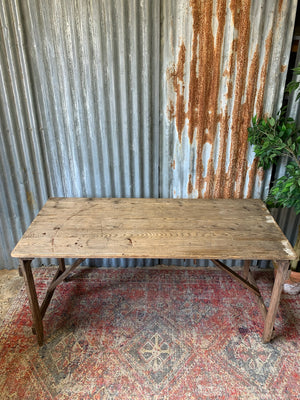 A 19th Century wooden folding trestle table