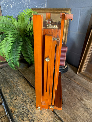 A floor-standing wooden field easel