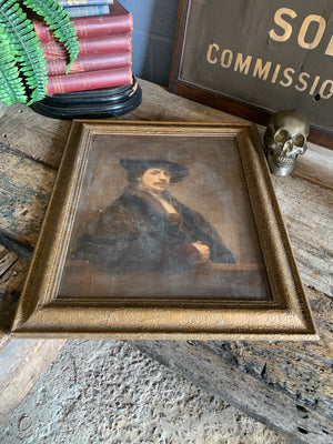 An framed oleograph of Rembrandt's "Self portrait at 34"