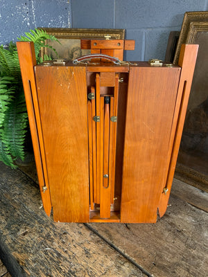 A floor-standing wooden field easel