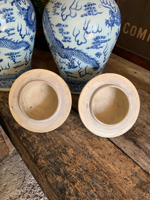 A pair of large blue and white ginger jars