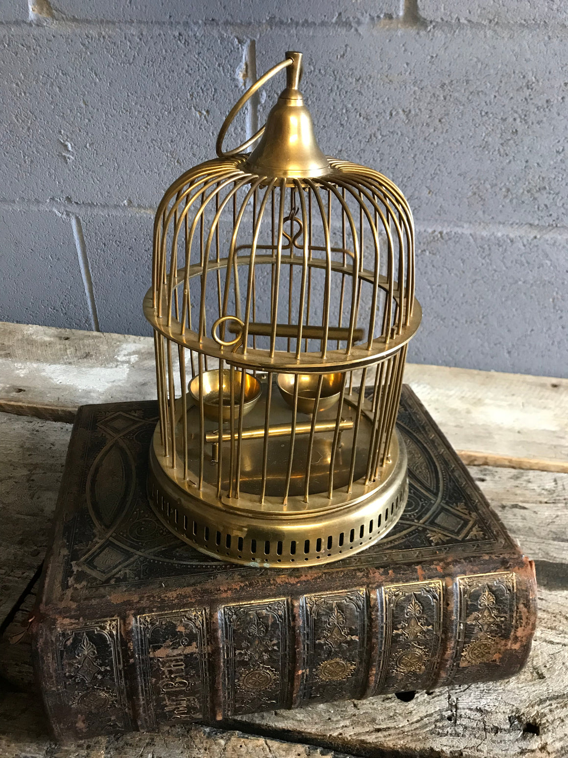 A solid brass bird cage