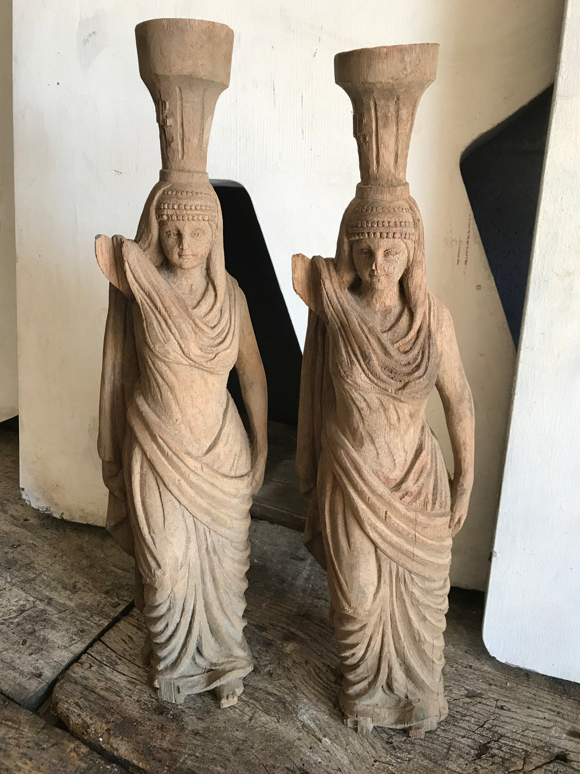 A pair of wooden hand-carved Arab female figures