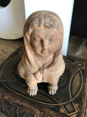 A hand-carved wooden Egyptian sphinx figure