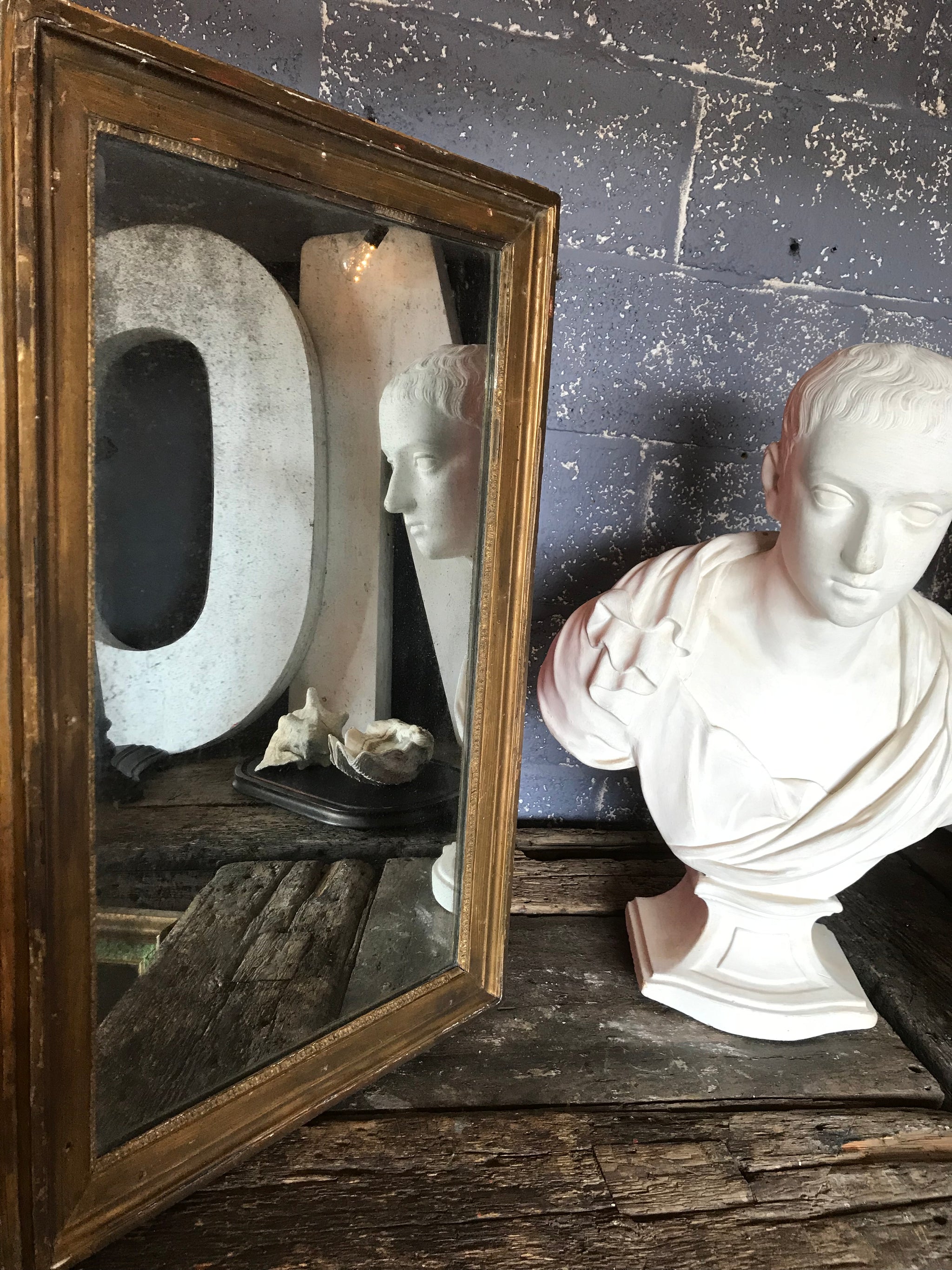 A large 19th Century Neoclassical Roman bust of Severus Alexander in white plaster