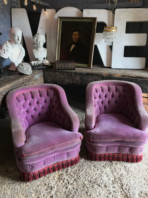 A glorious pair of purple velvet button back Hollywood Regency chairs