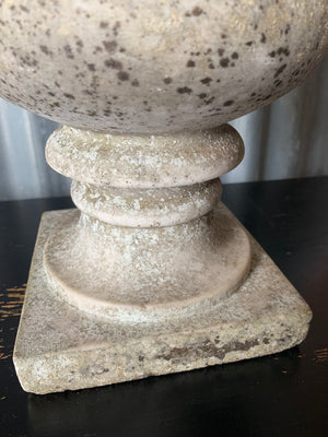 An elegant white grey marble urn