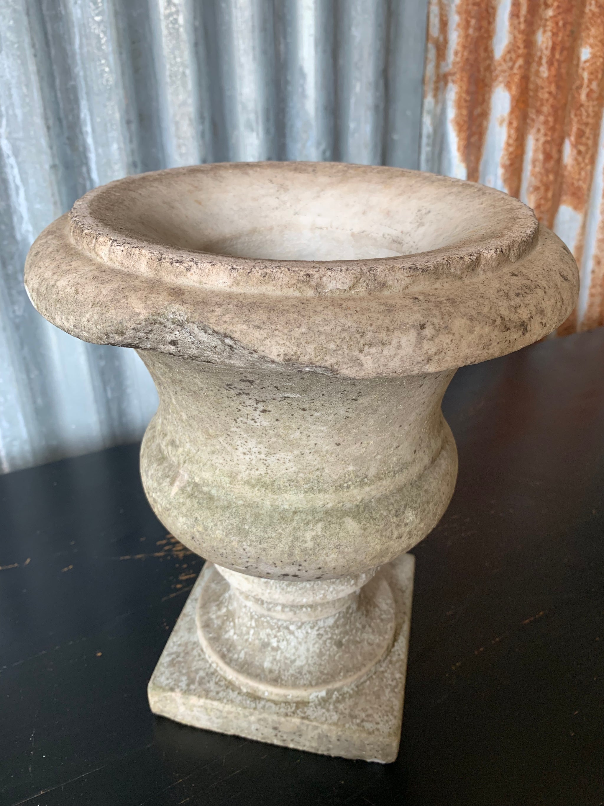 An elegant white grey marble urn